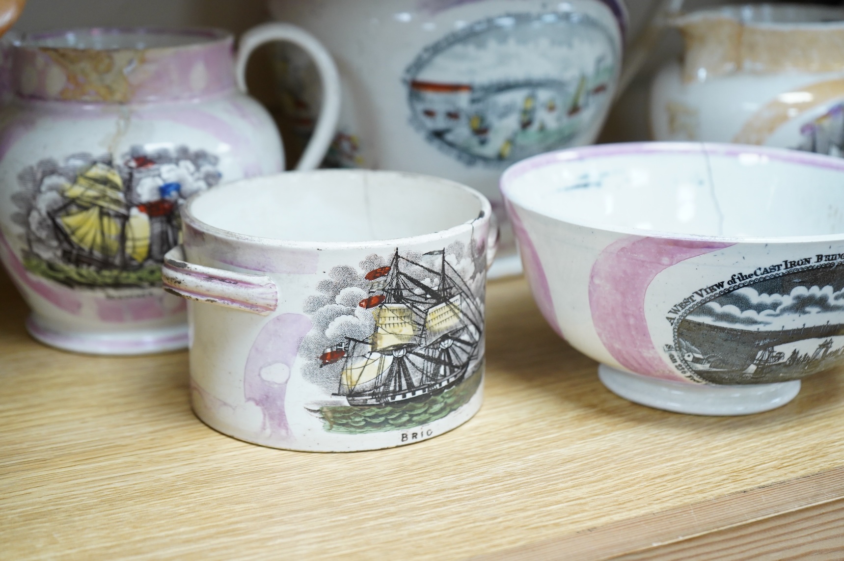Six early 19th century commemorative jugs and bowls, three with transfer printed scenes of the cast iron bridge over the River Wear commemorating the opening in 1796, together with three others with naval themes, largest